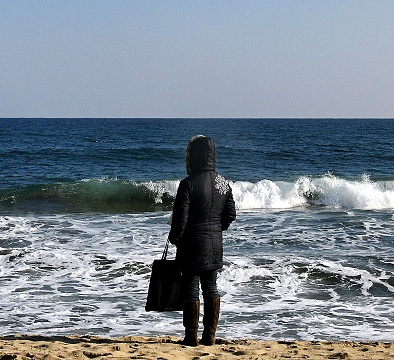 Lonely Woman Watching Sea Waves on Beach